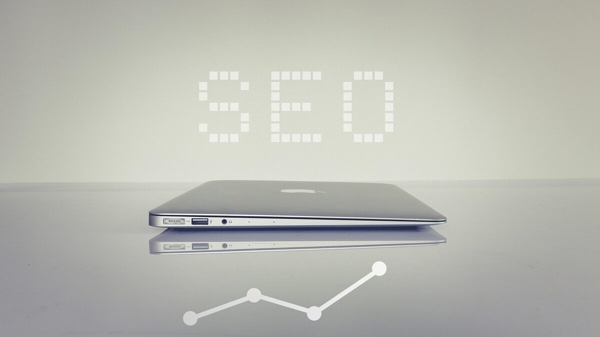 The word SEO displayed above a laptop, representing the core services an SEO company provides